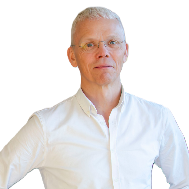 Person in white shirt, smiling at camera.