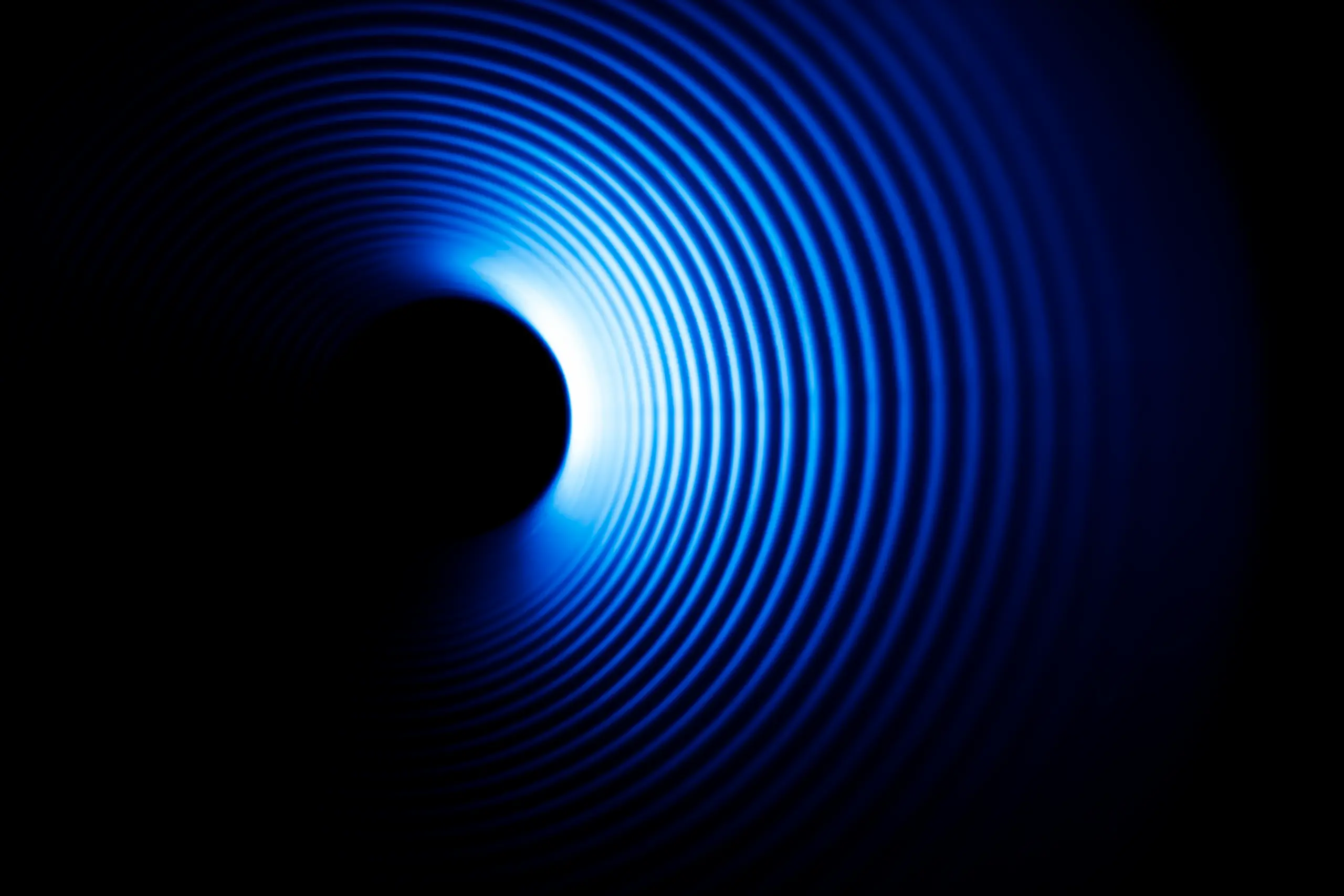 Blue concentric rings of light